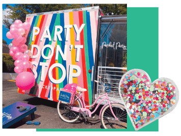 A party trailer surrounded by pink balloons.