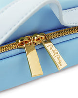 Gold zipper and luxe hardware closeup 