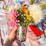 Pen cup used as flower vase with colorful bouquet. Multi purpose confetti cup.