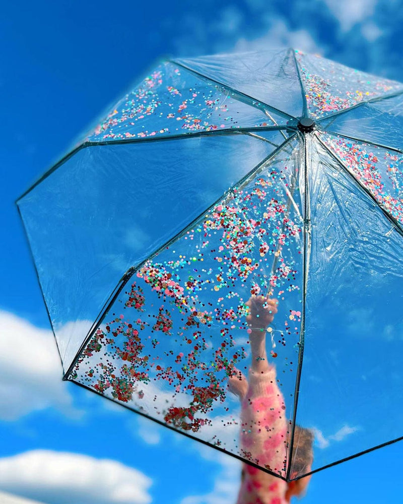 Opened umbrella in the sun against a bright blue sky