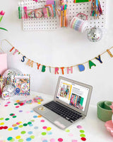 Mini birthday banner with multicolor confetti mix on tale