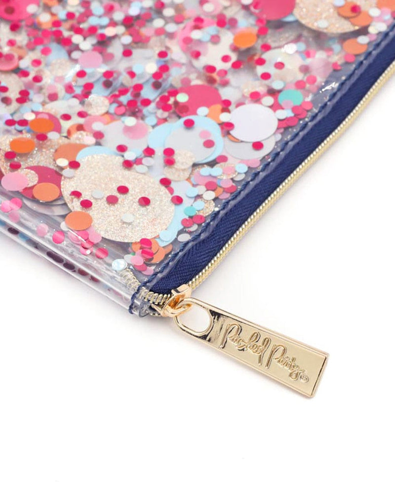 Navy zipper with gold hardware and tag closeup of colorful confetti essentials mix. 