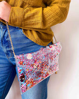 Girl wearing a clear purse that has bright confetti