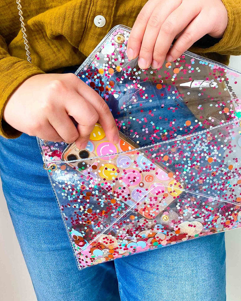 Cute clear purse with confetti and a phone