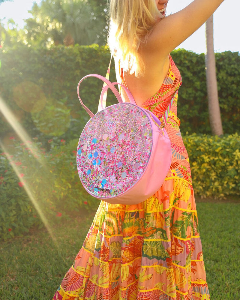 Girl wearing colorful beach dress, carrying cooler bag for cold drinks lunch carrying for pool or beach summer fun