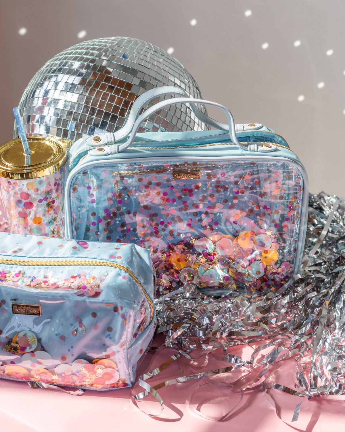 Traveler makeup and cosmetic bag, travel case and matching tumbler.