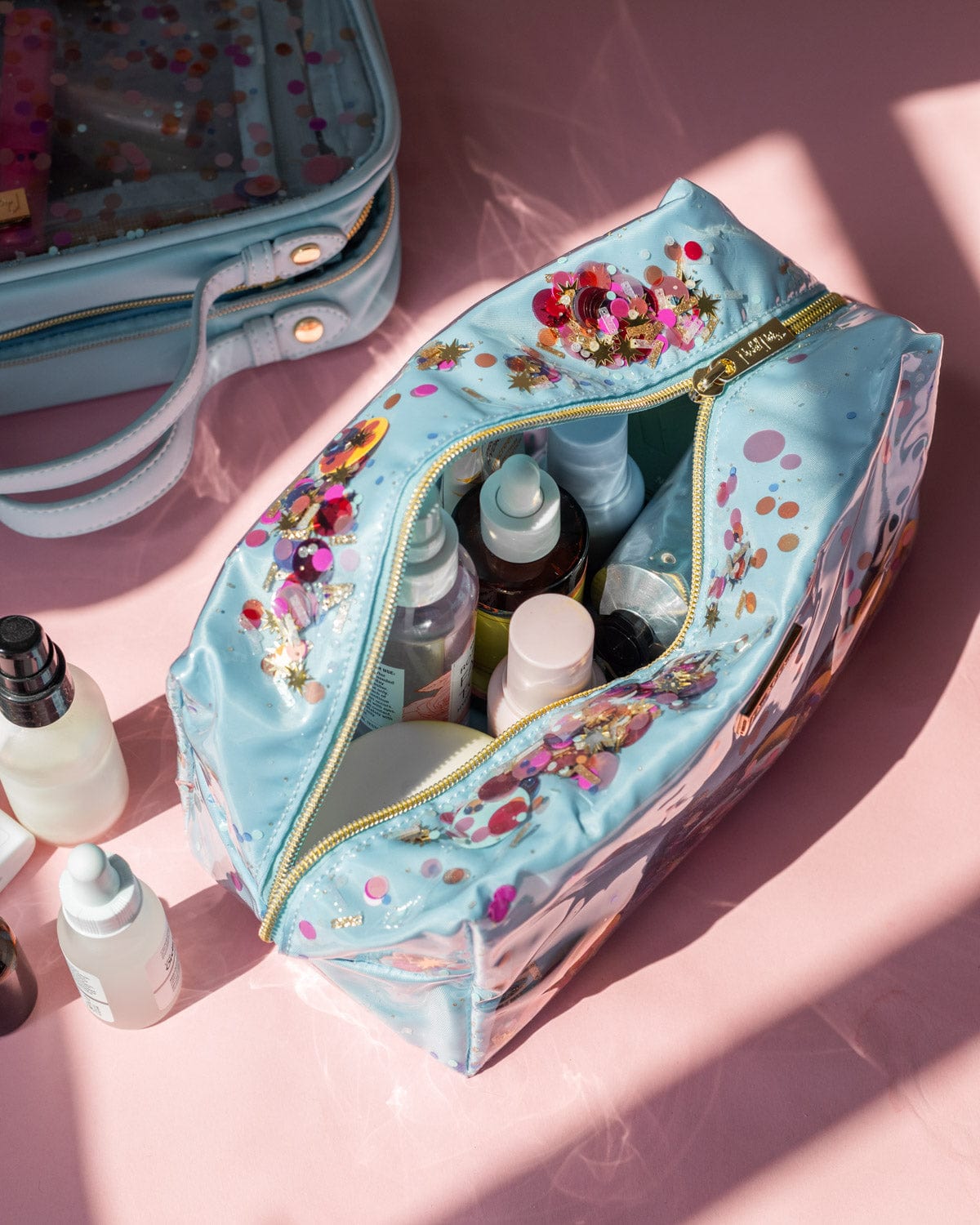 Makeup bag filled with makeup and skincare products on the go perfect for travel and vacations.