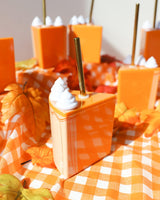 Gold straw in pumpkin pie sipper with whipped cream topper. 