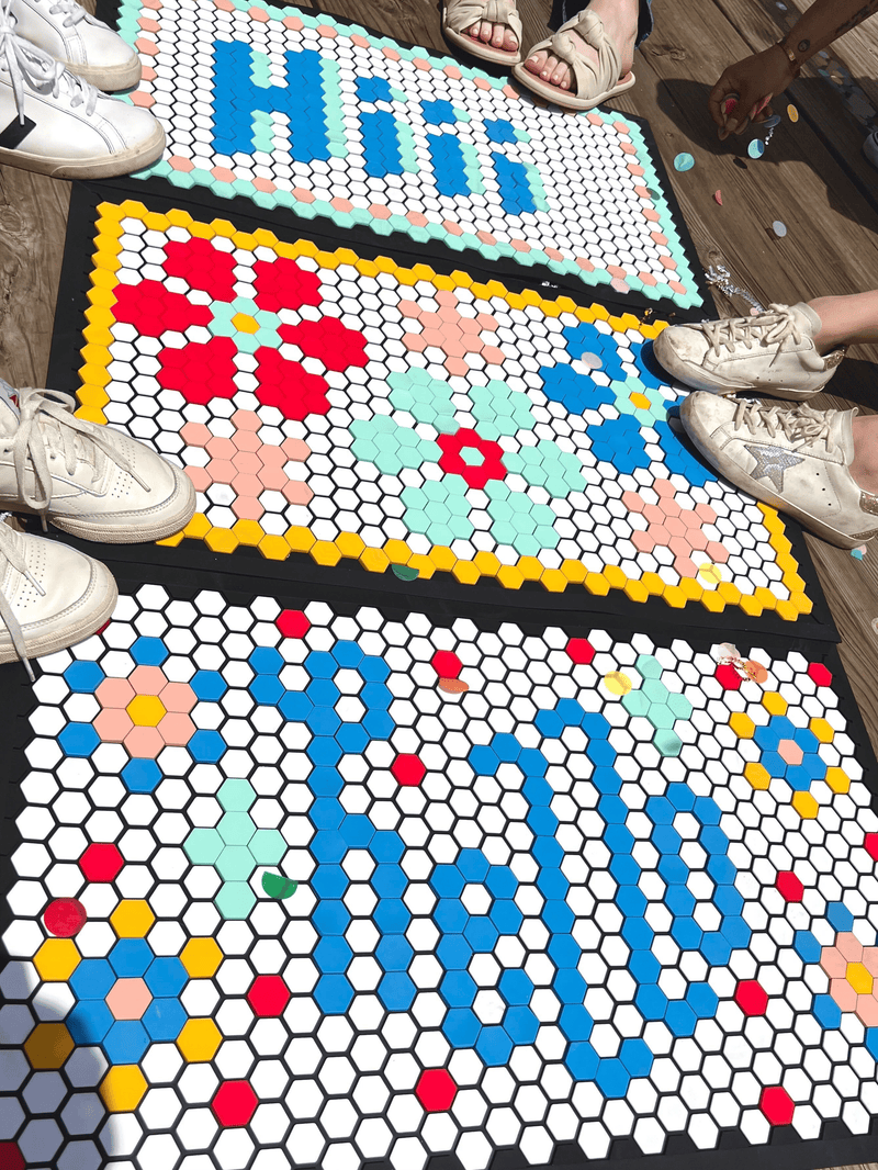 Packed Party and Letterfolk doormats with flowers, Hi and Hello sayings. Blue, mint, yellow, red and pink colorful tiles!