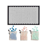 Letterfolk tile mat with light pink, mint and blue tiles with white and black mat.