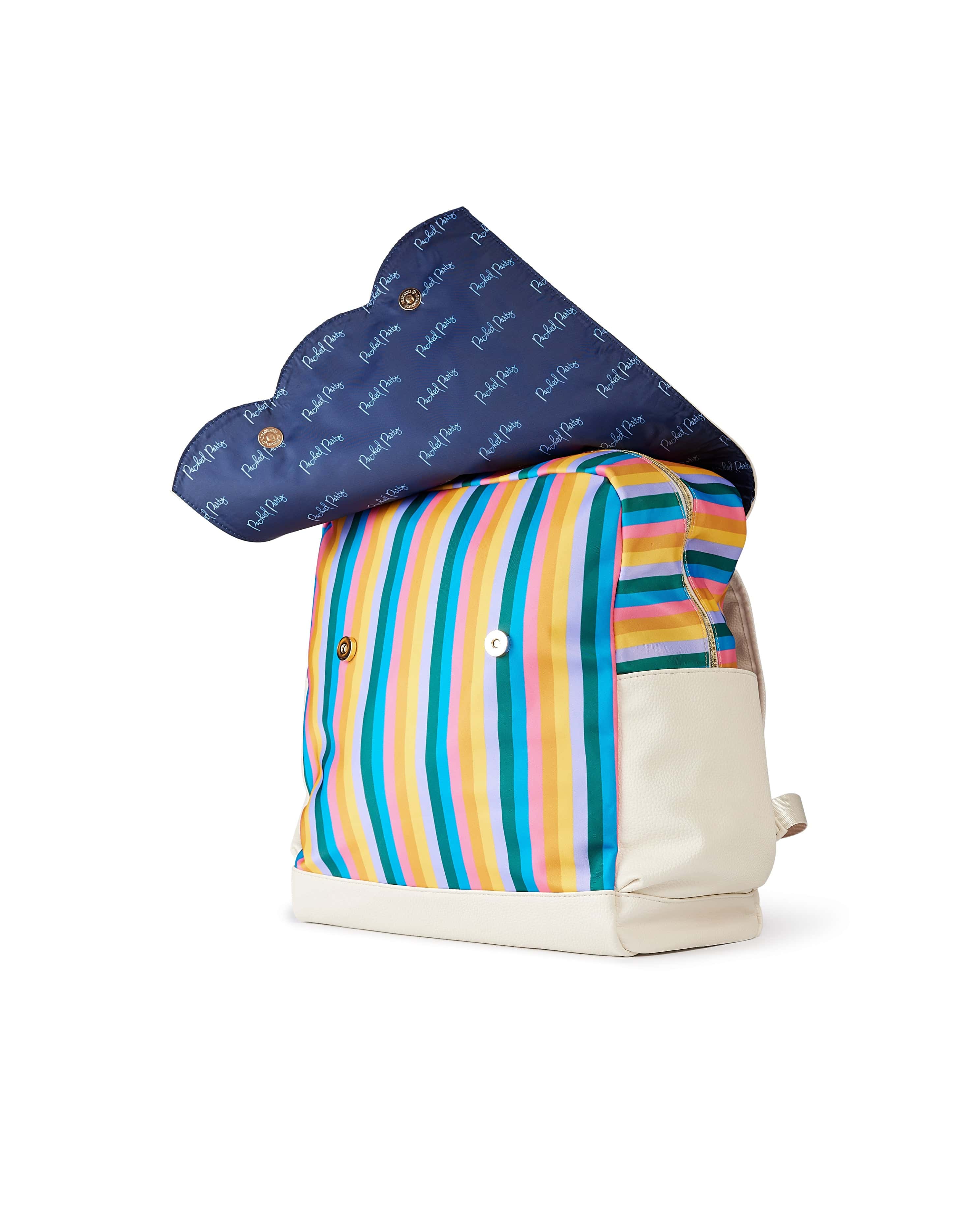 Snaps of rainbow diaper bag backpack open to show Packed Party logo interior and zip closure zip closure 