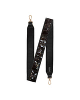Black confetti purse strap with black confetti, showing off black leatherette material and gold hardware.