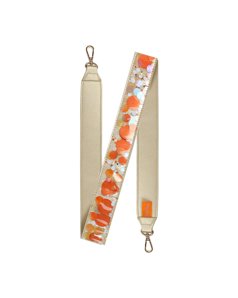 Orange confetti purse strap with orange confetti, showing off gold leatherette material and gold hardware.