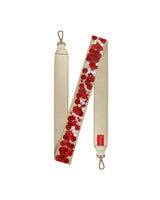Red confetti purse strap with red confetti, showing off gold leatherette material and gold hardware.