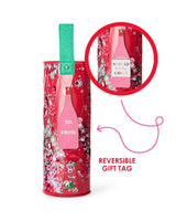 Infographic highlighting pink reversible gift tag in wine bottle shape that reads "spread holiday cheer" attached to confetti wine bag.