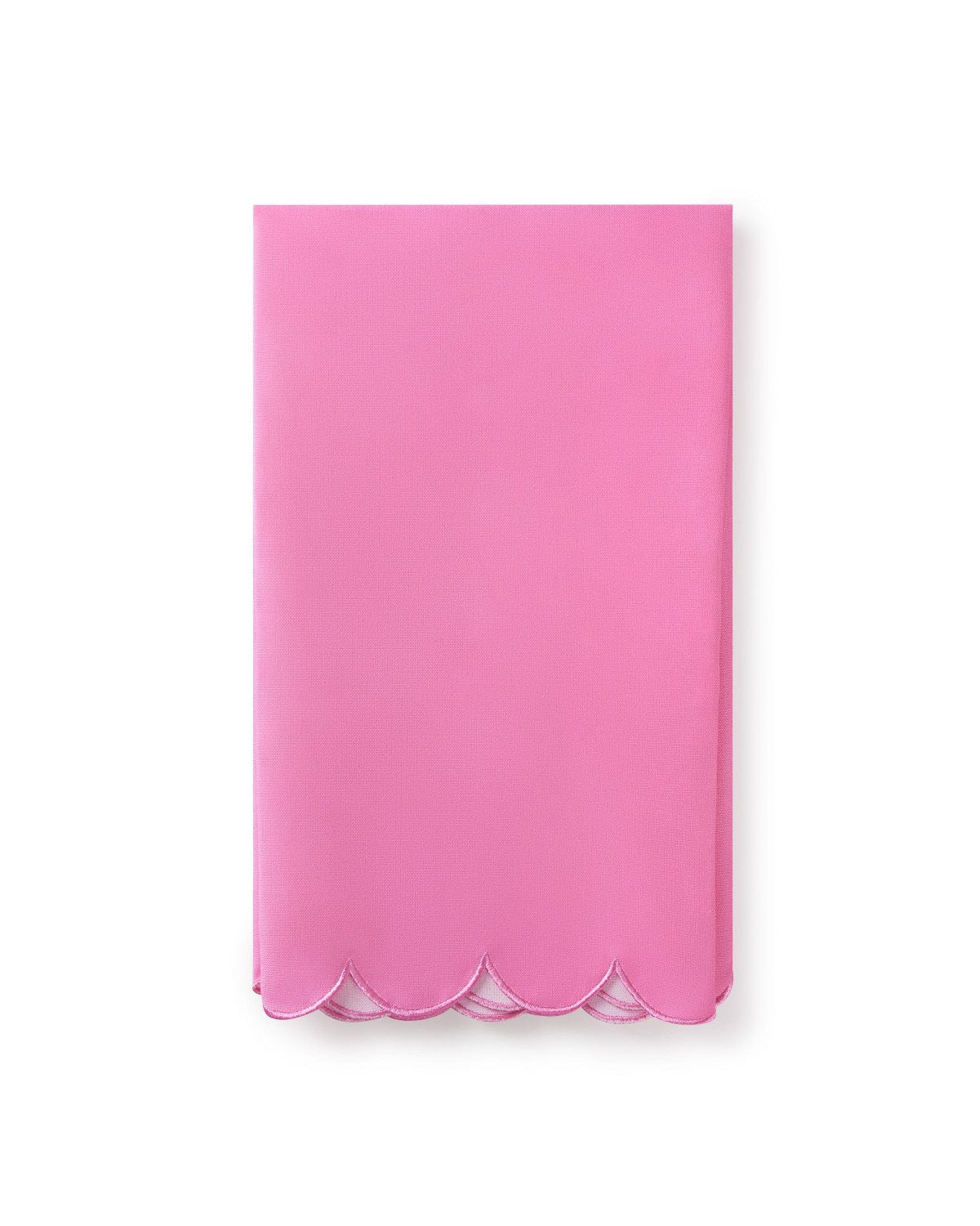 Blank back side of pink gingerbread house tea towel shot against white background. 