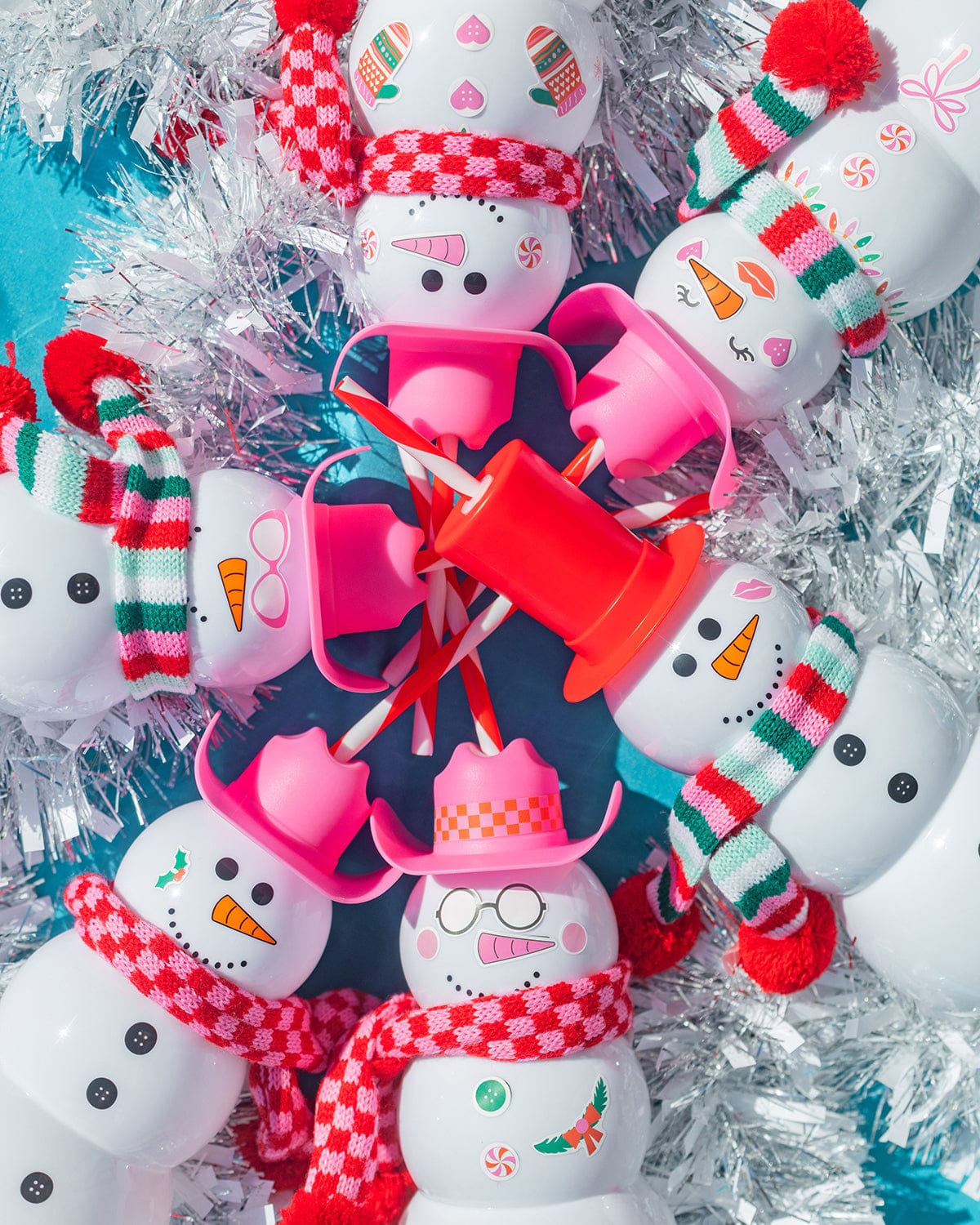 Six snowman sippers each in a unique custom look using the stickers in the kit. All of them are happy with bright colors and smiles. Fun holiday party scene.