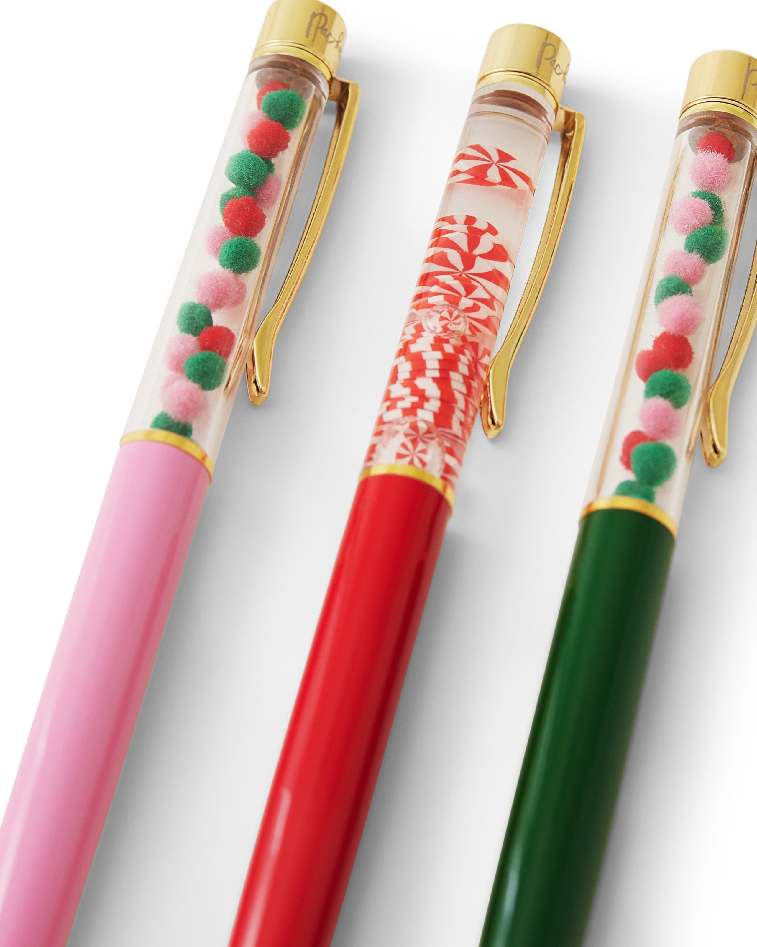 Up Close festive holiday confetti and gold hardware shot against white background. 