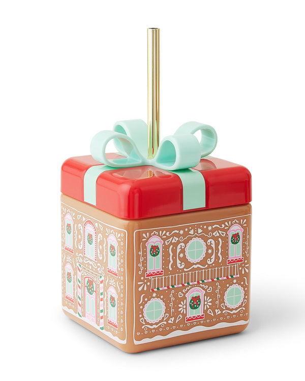 A gift box shaped sipper with a gingerbread house pattern.