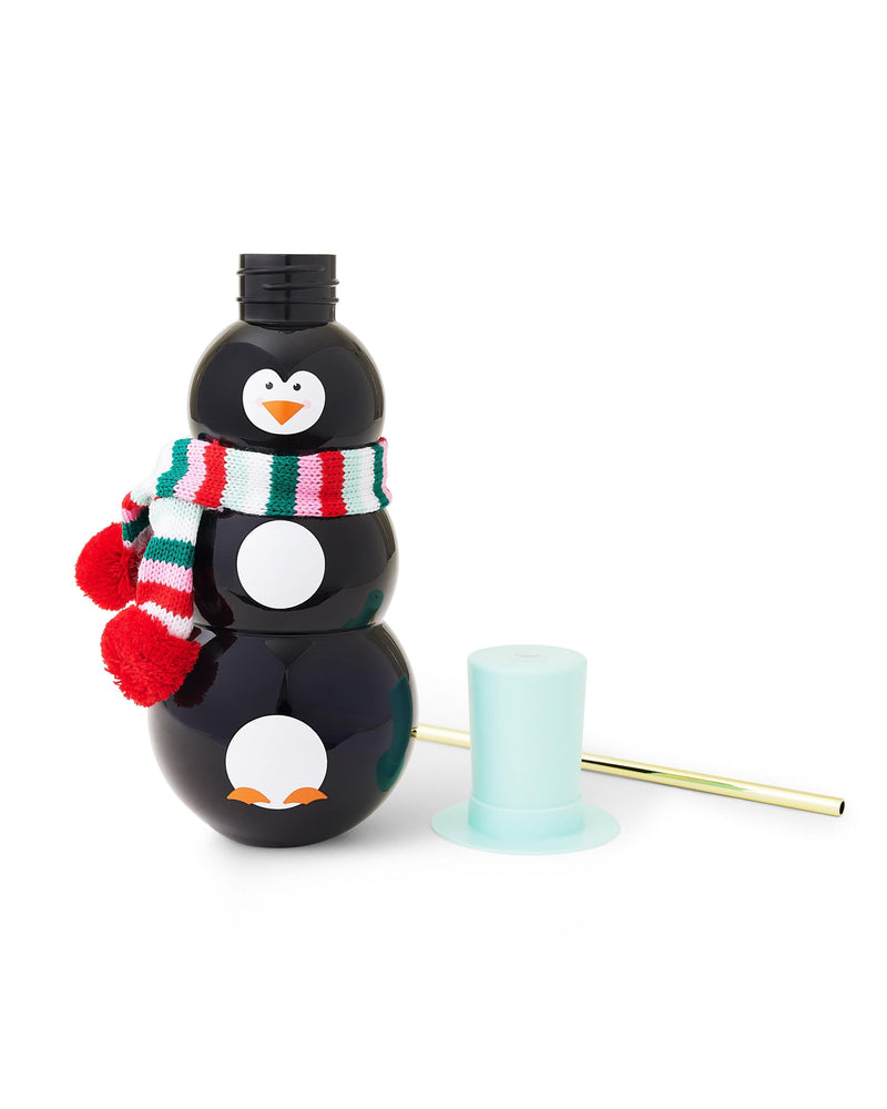 Black penguin sipper cup with mint top hat and gold straw laying down. 