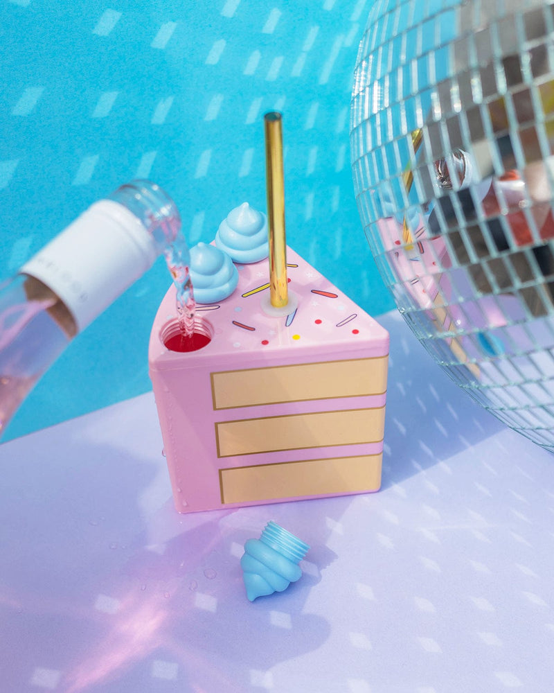 A set of 6 cake slice sippers with gold straws. Wine being poured in next to disco ball in a party scene