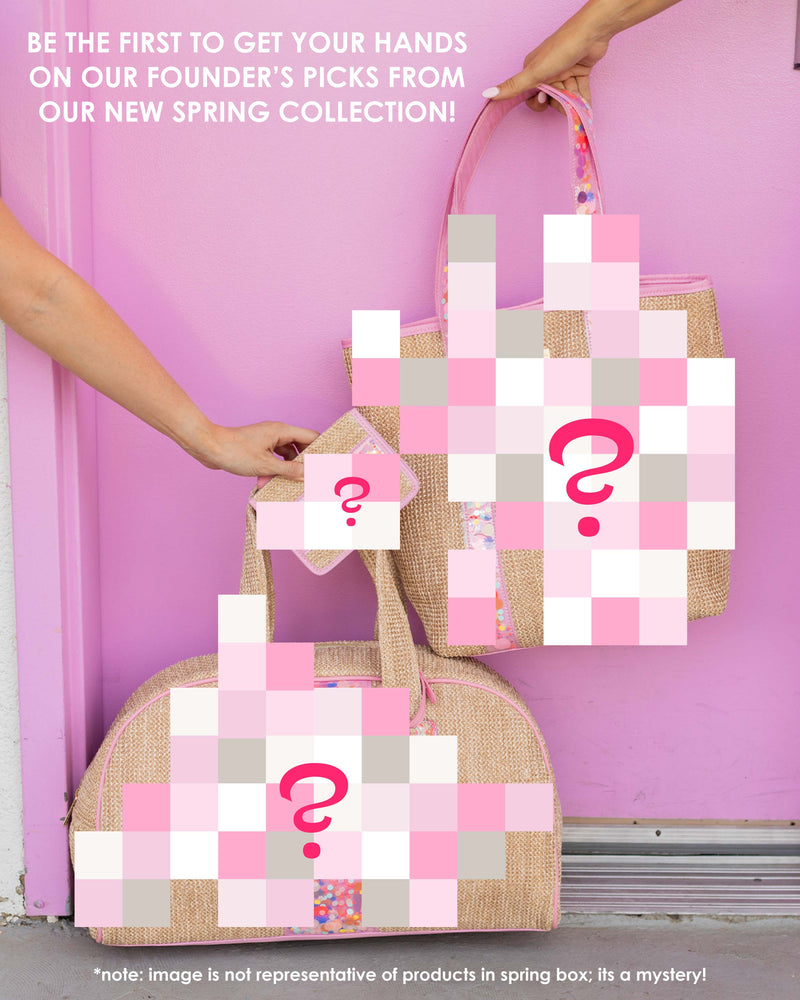 three mystery items from our spring collection in front of pink door