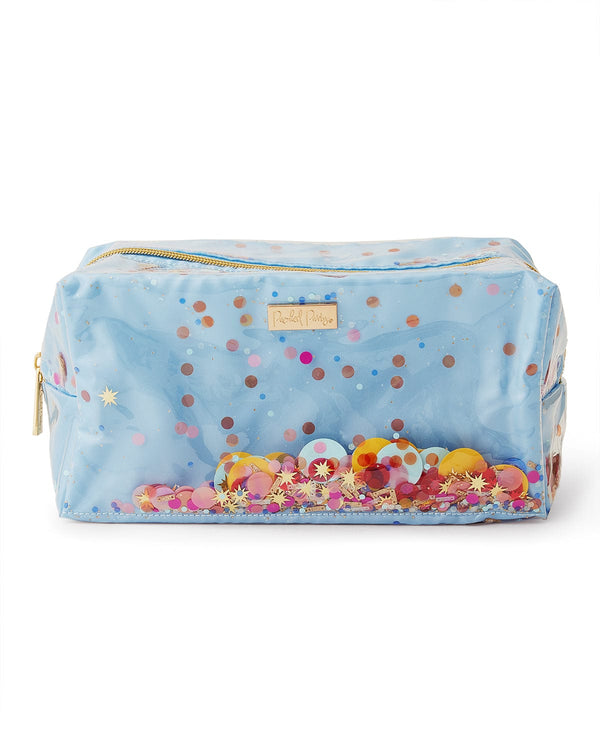 A blue toiletry bag filled with confetti and with a gold zipper. 