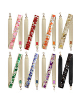 Gold and colorful straps featuring black, pink, gold, red, orange, green and blue confetti straps folded in half 