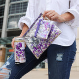 girl holding a purple confetti pouch, keychain wallet and koozie