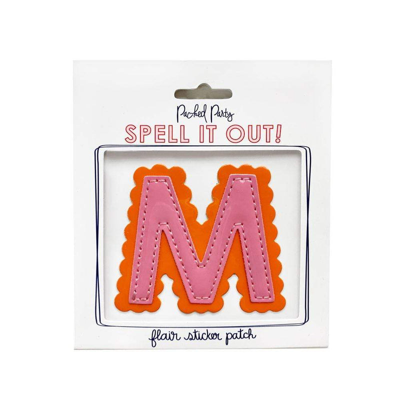 Pink and orange scalloped letter M sticker.